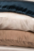 Stack of mulberry silk pillowcases in assorted colours